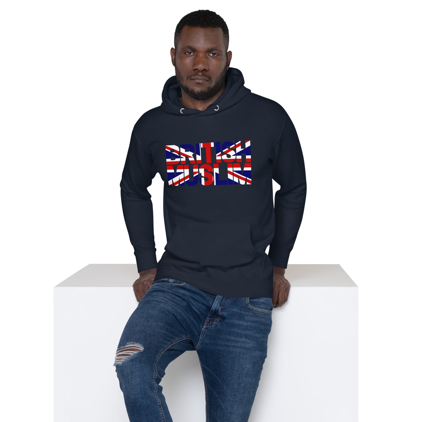 A man wearing a navy coloured Unisex Hoodie with the text saying BRITISH MUSLIM that is also in the colours of the british flag.